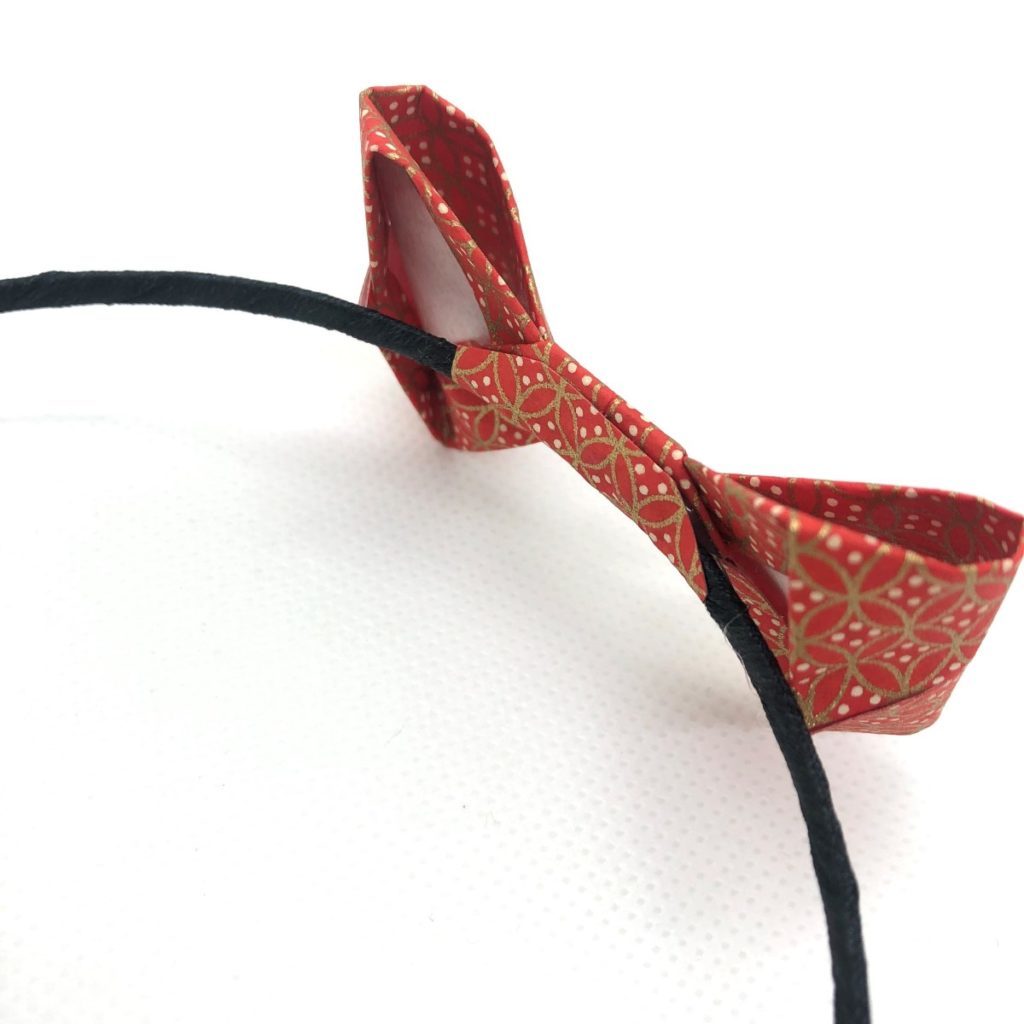 Serre-tête avec nœud en origami rouge et doré